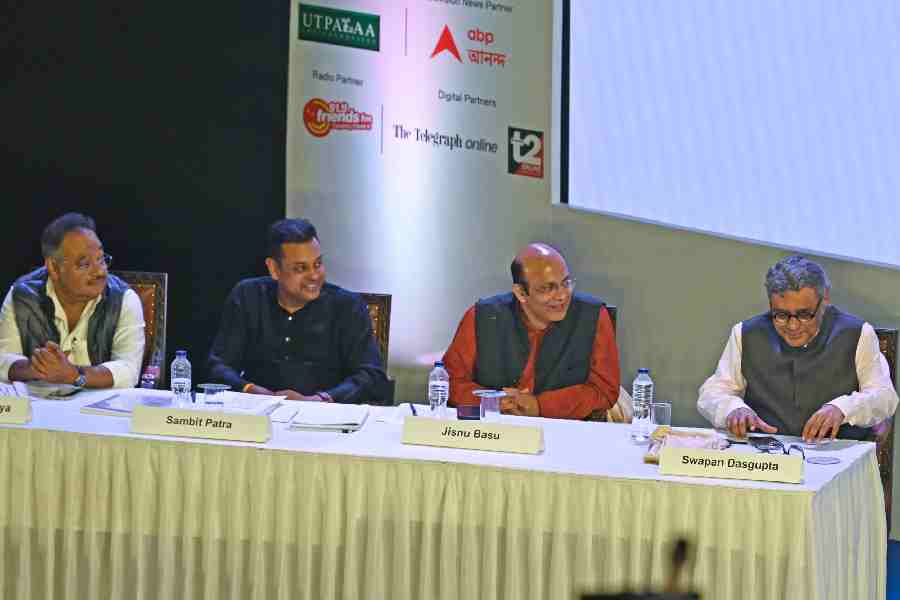 The panelists gather on stage.