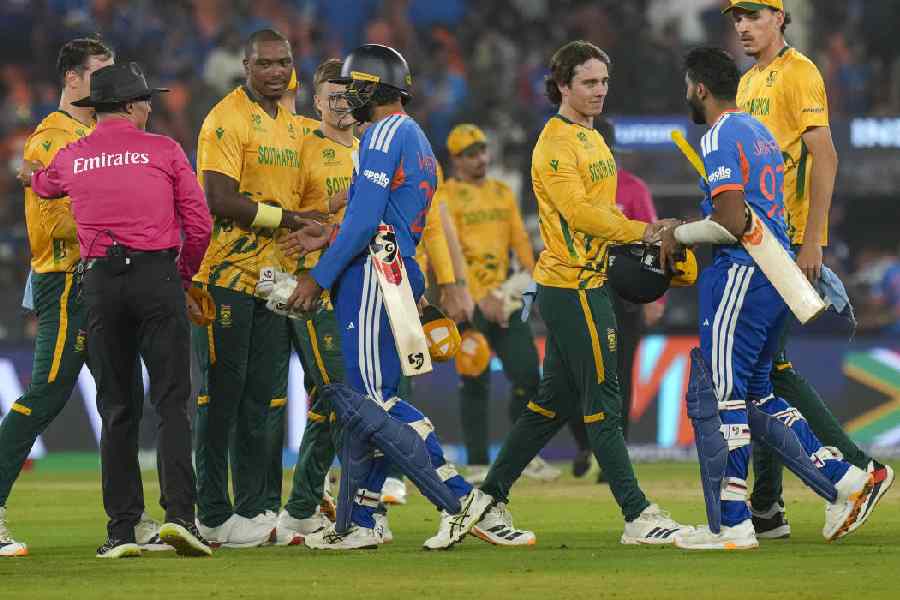South Africa's players being congratulated by India's Varun Chakravarthy and Jasprit Bumrah after winning the ICC Men's T20 World Cup 2026 cricket match