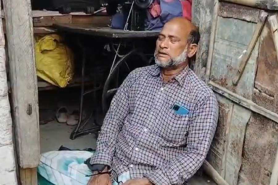 Akhtar Hossain, the father of Umar Farooq, at his home on Monday. 