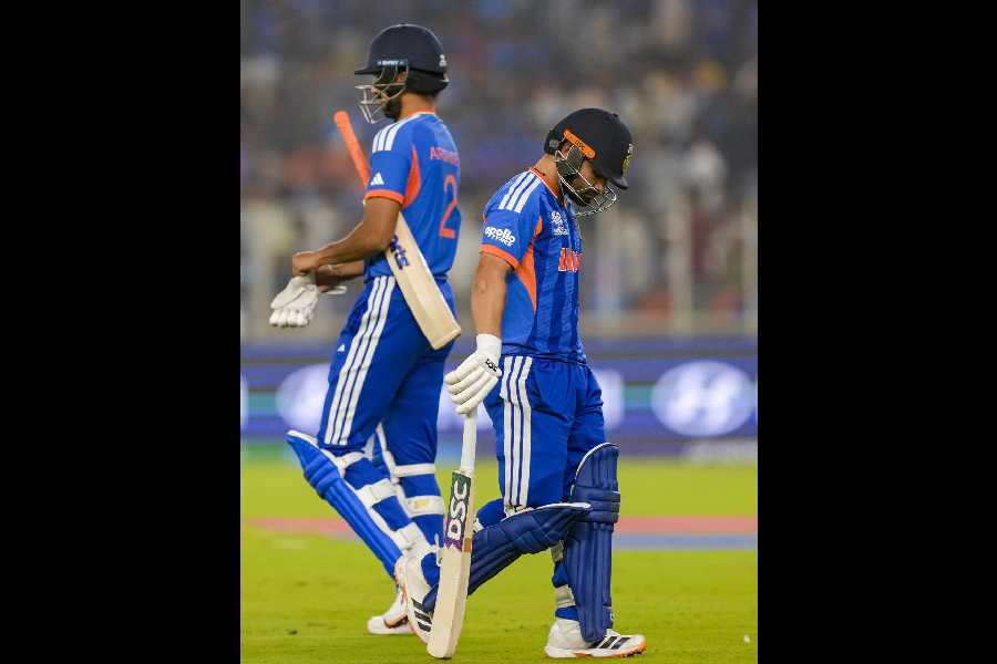 Rinku Singh (right) walks back on Sunday.