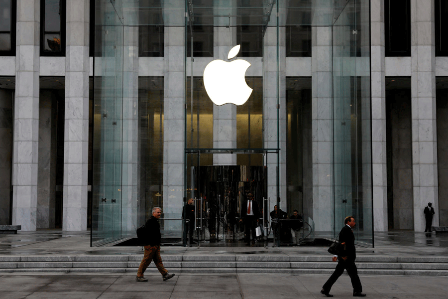 The Apple Inc. logo is seen hanging at the entrance to the Apple store on 5th Avenue in New York