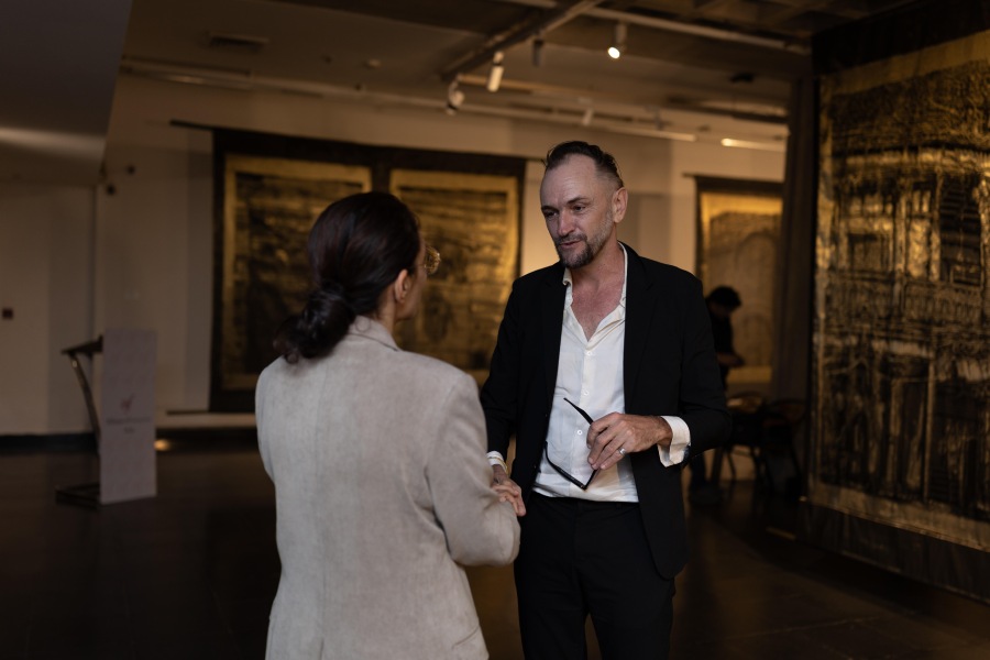 Thomas Henriot in conversation at the exhibition of his artwork in Delhi 