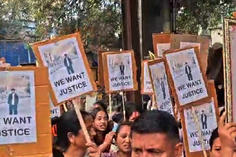 Family members and acquaintances of the youth, who died in the hit-and-run, demonstrate on the campus of the Siliguri court on Tuesday.