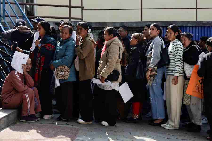 People planning to leave the country and apply for foreign employment in search of better opportunities queue as they prepare for an interview at Motherland Overseas, a recruitment agency, as Nepal's biggest political parties vow to fix the outflow of workers ahead of the elections of the House of Representatives scheduled for March 5, triggered by historic youth-led protests fuelled by the lack of jobs and endemic corruption that forced an elected prime minister to resign, in Kathmandu, Nepal, February 22, 2026.