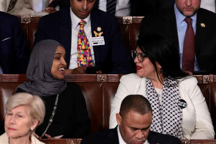 U.S. Representative Rashida Tlaib (D-MI) wears a "Fuck ICE" pin as she sits next to U.S. Representative Ilhan Omar (D-MN) during U.S. President Donald Trump's State of the Union address to a joint session of Congress at the U.S. Capitol in Washington, D.C