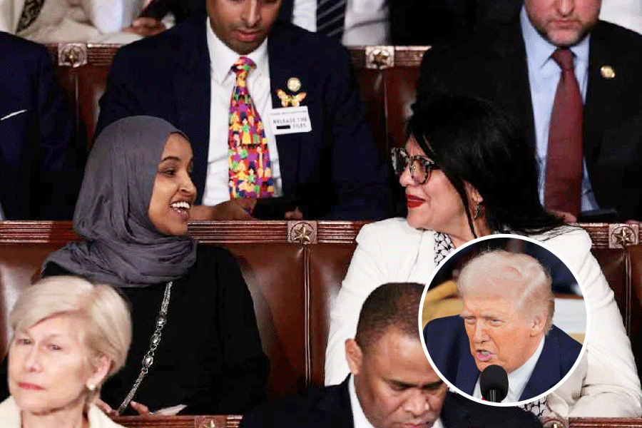 U.S. Representative Rashida Tlaib (D-MI) wears a "Fuck ICE" pin as she sits next to U.S. Representative Ilhan Omar (D-MN) during U.S. President Donald Trump's State of the Union address to a joint session of Congress at the U.S. Capitol in Washington, D.C