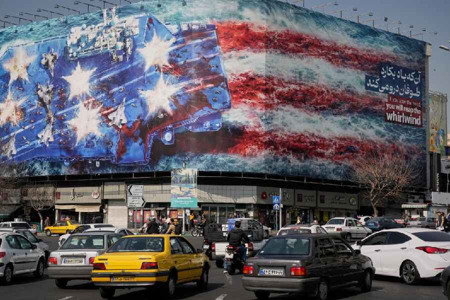 A billboard in Iran depicting a U.S. aircraft carrier with damaged fighter jets on its deck
