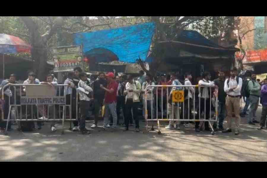 Applicants outside the passport offices on Brabourne Road and (right) near Ruby hospital after the bomb threat evacuation on Thursday