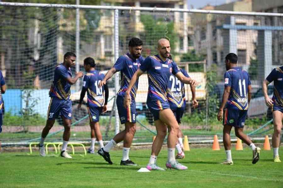 East Bengal's Youssef Ezzejjari (front) and Miguel Figueira warm up before Thursday's training session at the Salt Lake Stadium Training Ground. 