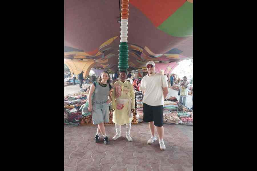 The acrobat poses with visitors