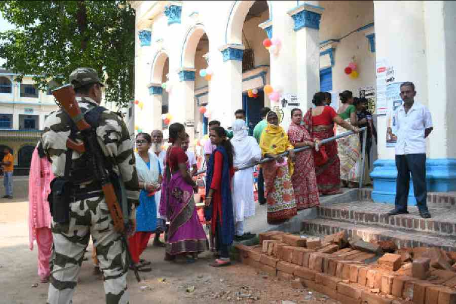 Watchful eye: Central Force personnel guarding a polling station on Monday in Nadia