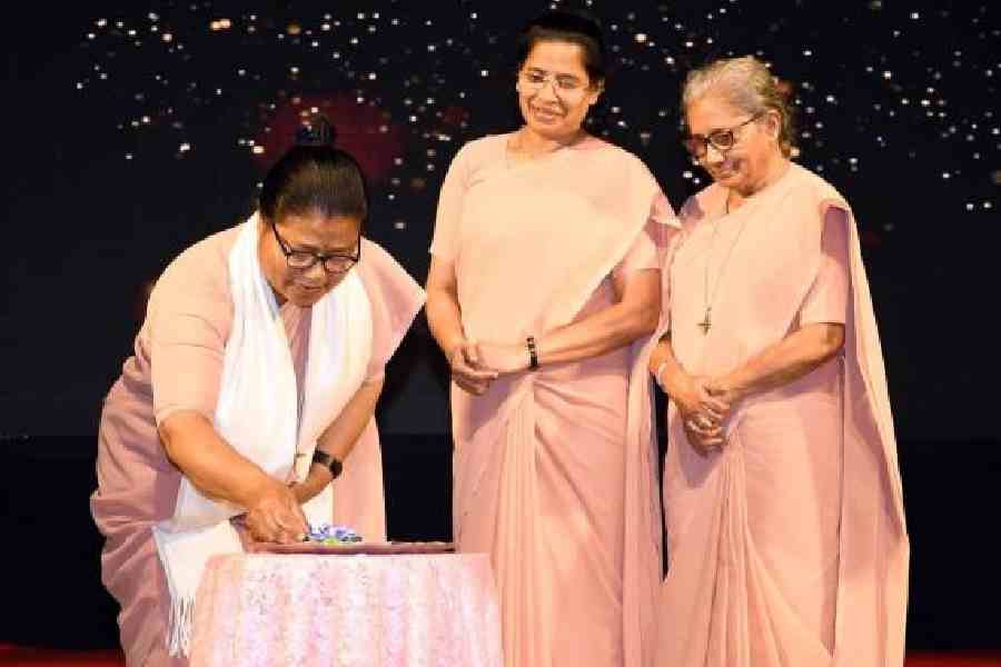 Sister Crescencia Sun, provincial superior of Kolkata province, prepares to light the ceremonial lamp at EZCC