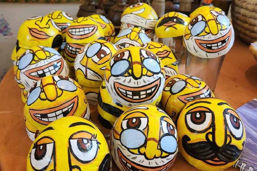 Coconut shells cut and painted and turned into glass covers at Nuttshell Handicrafts