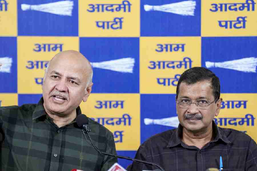 AAP chief and former Delhi chief minister Arvind Kejriwal, right, and party leader Manish Sisodia address a press conference after getting a clean chit in the liquor policy case, in New Delhi, Friday, Feb. 27, 2026.