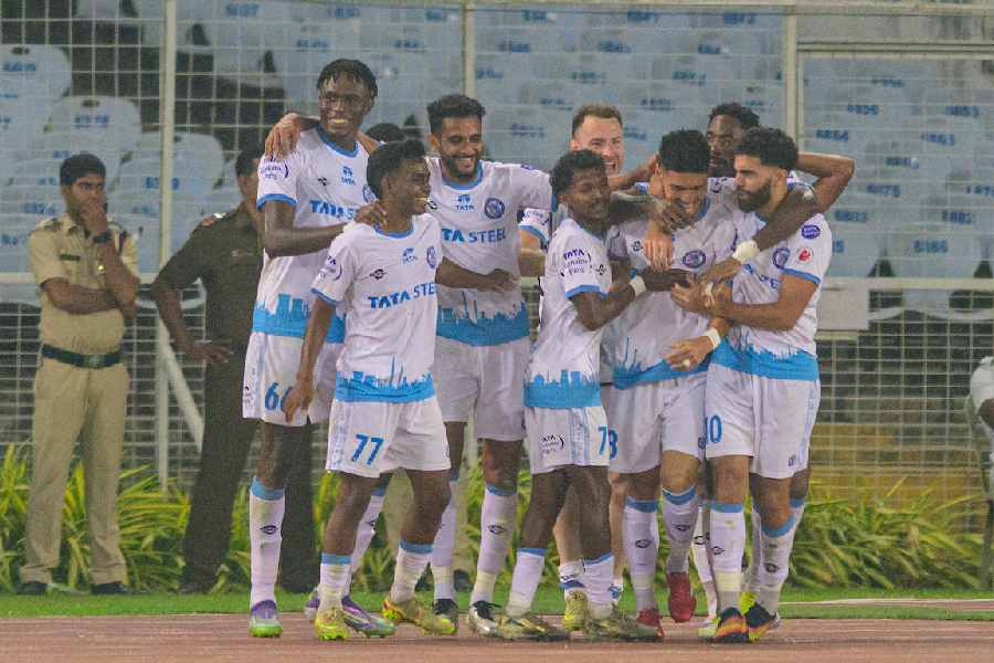 Rei Tachikawa (third from right) of Jamshedpur FC celebrates with teammates after scoring against East Bengal.