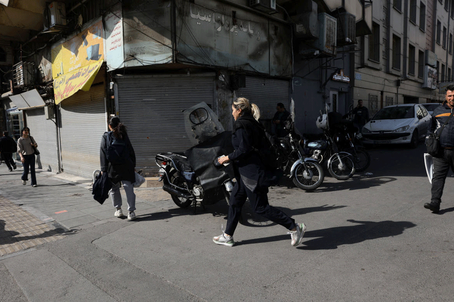 People run for cover following an explosion, after Israel said it launched a pre-emptive attack against Iran, in Tehran, Iran February 28, 2026.