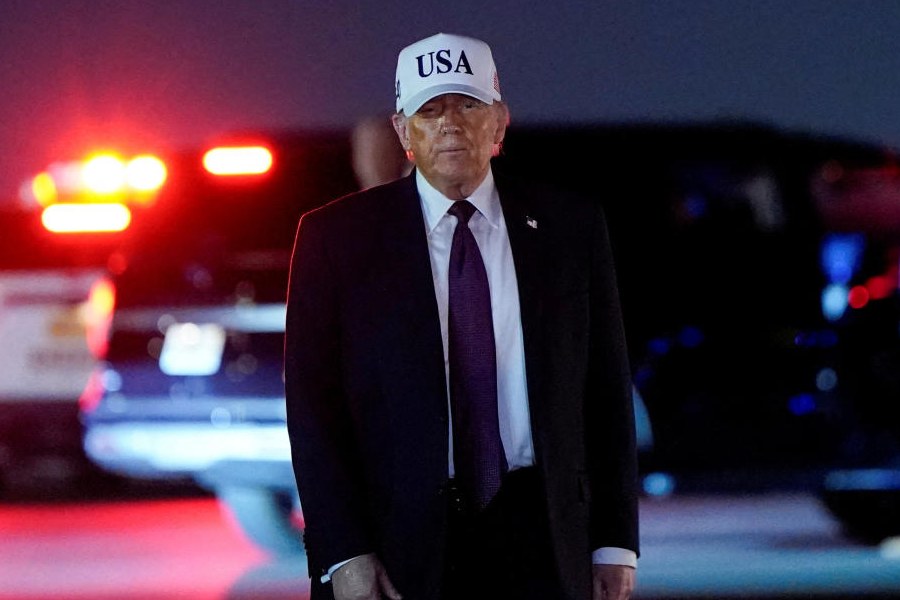 US President Donald Trump looks on after disembarking Air Force One at Palm Beach International Airport in West Palm Beach, Florida, U.S., February 27, 2026.