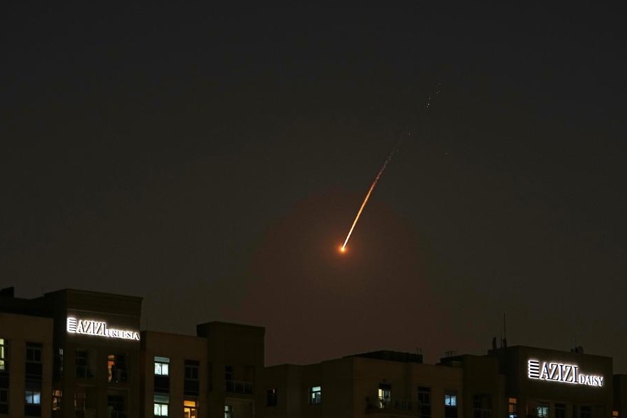 The flare of a projectile is seen over the skyline of Dubai, United Arab Emirates, Saturday, Feb. 28, 2026.