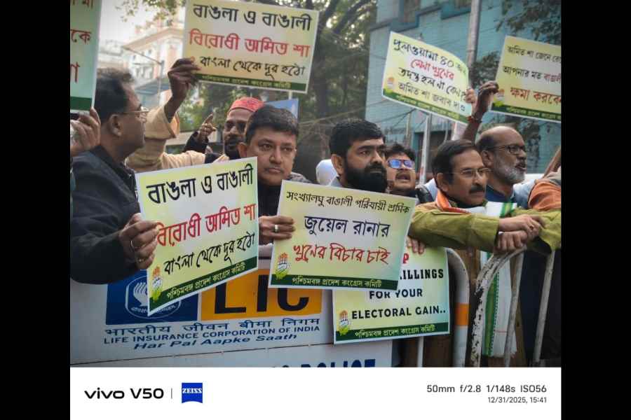 Congress workers led by state chief Subhankar Sarkar stage a protest against Amit Shah in Calcutta on Wednesday for the recurrent attacks on migrant workers from Bengal in BJP-ruled states. The protest was staged at College Street-Mahatma Gandhi Road crossing, through which Shah was travelling. Sarkar termed Shah as anti-Bengal and burnt his effigy