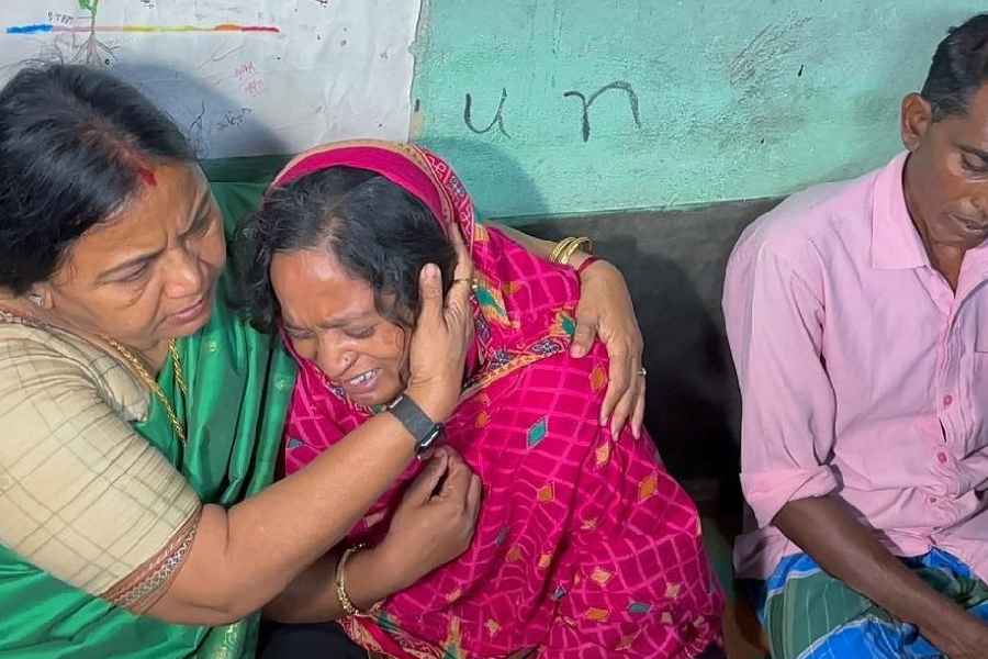 Sabina Yasmin breaks down while speaking to National Commission for Women member Archana Majumdar at her residence in Molandi village.