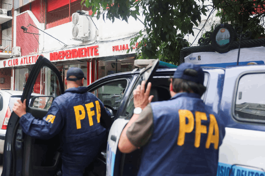 Members of the Argentine Federal Police leave a branch of the soccer team Club Atletico Independiente, after a raid, amid an investigation into alleged money laundering involving the Argentine Football Association and a group of soccer clubs, according to local media, in Buenos Aires, Argentina December 9, 2025.