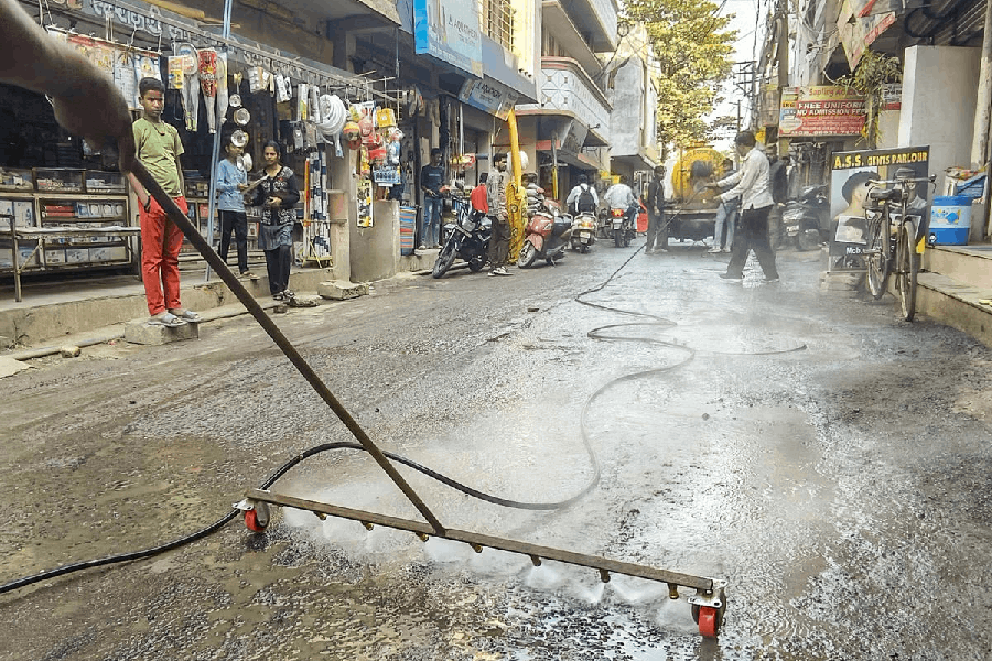 Indore Municipal Corporation workers conduct a cleanliness drive after several people were affected due to consumption of contaminated water at Bhagirathpura area, in Indore, Madhya Pradesh, Wednesday, Dec. 31, 2025.