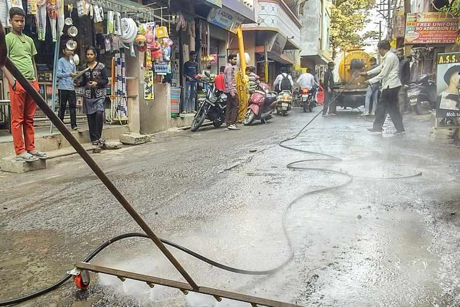 Indore Municipal Corporation workers conduct a cleanliness drive after several people were affected due to consumption of contaminated water at Bhagirathpura area, in Indore, Madhya Pradesh, Wednesday, Dec. 31, 2025.