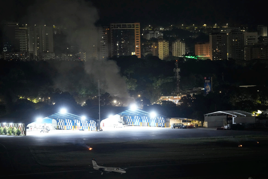 Smoke raises at La Carlota airport after explosions and low-flying aircraft were heard in Caracas, Venezuela, Saturday, Jan. 3, 2026.