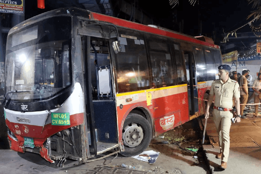 Police personnel at the site after a Brihanmumbai Electric Supply and Transport (BEST) bus accident, wherein encroachment of the sidewalk by hawkers forced pedestrians to step onto the road, leading to the death of four people, near Bhandup railway station in Mumbai, Monday night, Dec. 29, 2025.