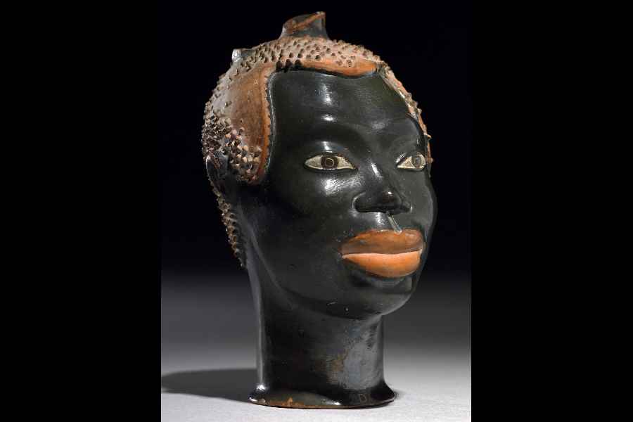 Perfume bottle in the form of a youth’s head glazed ceramic, Vulci, Italy; c. 510-500 BCE; From British Museum. 