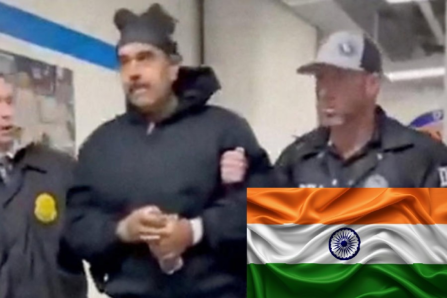 A still image from video posted by the White House's Rapid Response 47 account on X.com, which originated from the @PaulDMauro account, shows Venezuela's President Nicolas Maduro being walked in custody down a hallway at the offices of the U.S. Drug Enforcement Administration (DEA) in New York City, U.S., January 3, 2026.