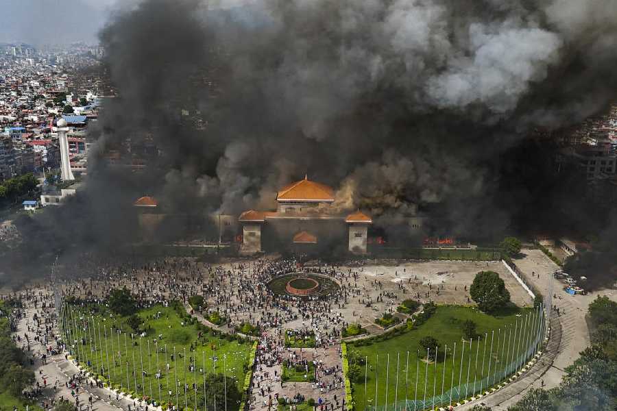 An aerial view of smoke rising from the Federal Parliament of Nepal premises after it was set on fire by protestors
