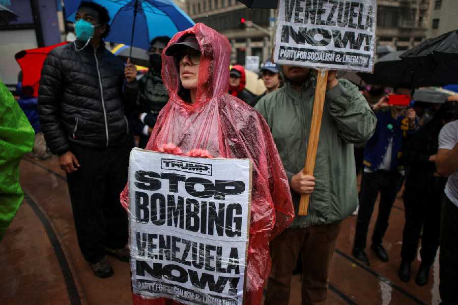 People protest against the U.S. strikes on Venezuela and the capture of Venezuelan President Nicolas Maduro, during an anti-war rally in LA