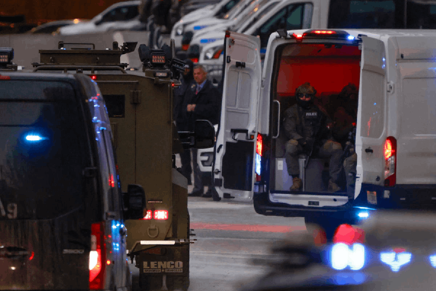 Federal law enforcement personnel ride ahead of an armored vehicle carrying Venezuelan President Nicolas Maduro and his wife Cilia Flores as it arrives at Manhattan Federal Court, Monday, Jan. 5, 2026, in New York.