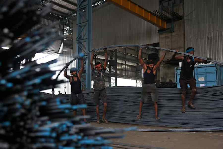 Employees work at a steel processing production line of a factory in Mandi Gobindgarh, in the northern state of Punjab, India, August 14, 2025.