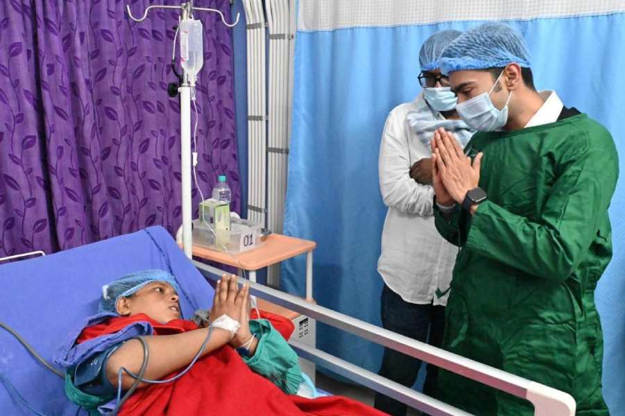 Abhishek Banerjee meets Sunali Khatun at the hospital in Rampurhat on Tuesday