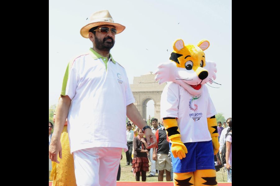 Suresh Kalmadi, then the chairman of the 2010 Commonwealth Games, with the Games mascot Shera in New Delhi.