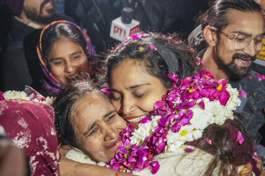 2020 northeast Delhi riots accused Gulfisha Fatima, right, meets her mother after her release from Tihar Jail, in New Delhi, Wednesday, Jan. 7, 2026.
