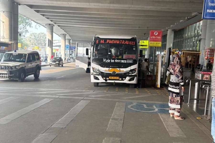 A bus parked outside the airport terminal at the arrival level last week. It remained parked for half an hour