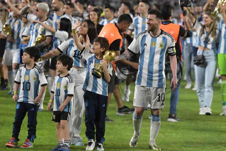 Lionel Messi of Argentina, wife Antonella Roccuzzo and his three sons celebrate with the World Cup after an international friendly match against Panama in Buenos Aires on March 23, 2023. 