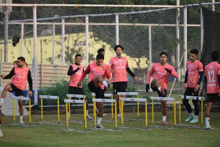 Emami East Bengal players warm up before Wednesday's training session at the Salt Lake Training Ground. 