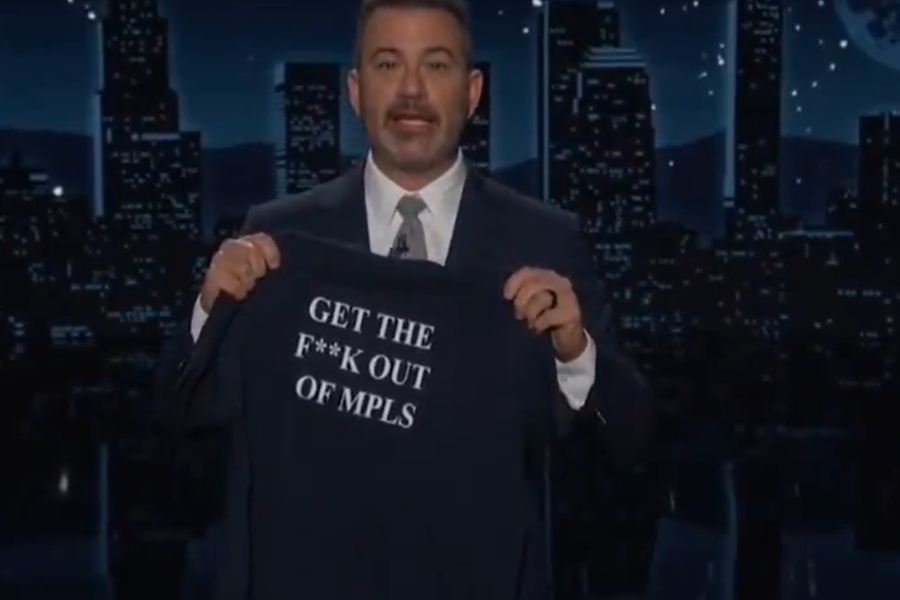 Jimmy Kimmel holding the ‘Get the f*** out of MPLS’ t-shirt