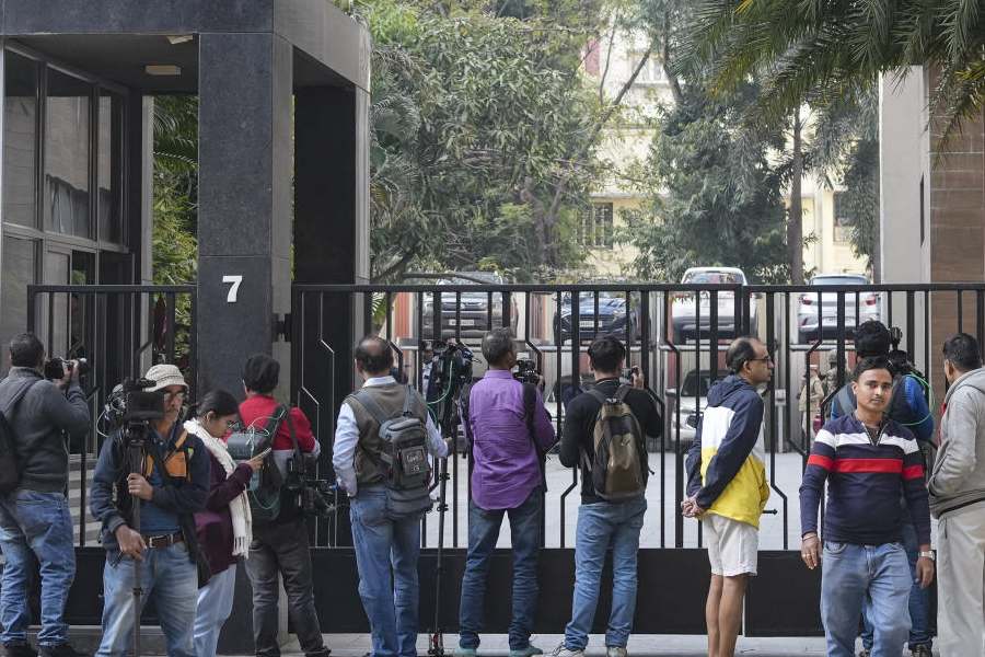 Media personnel outside the residence of Pratik Jain, director of political consultancy firm I-PAC, in Kolkata, Thursday, Jan. 8, 2026.