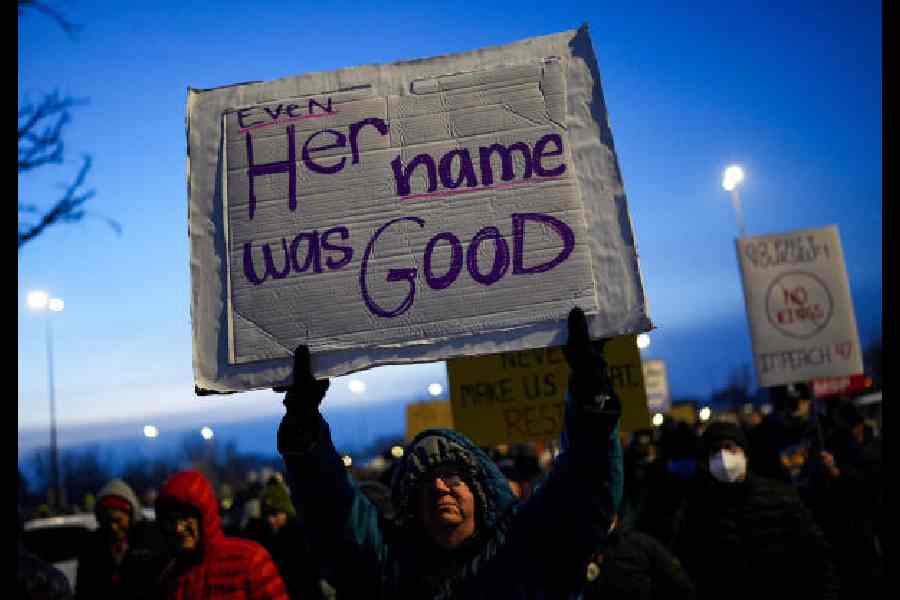 A man holds a placard at a protest in Minneapolis, Minnesota, on Thursday. 
