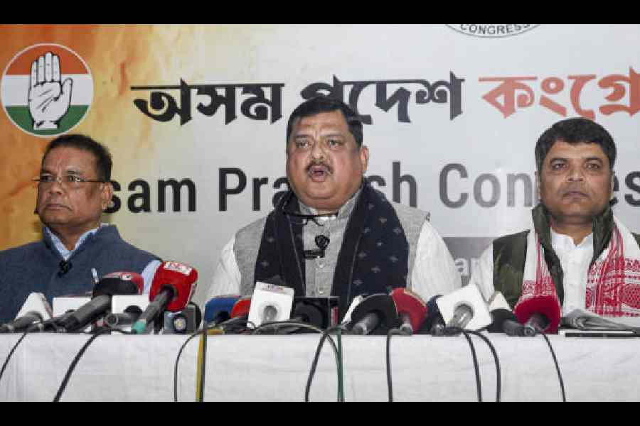 Rakibul Hussain (centre) addresses the media at Rajiv Bhavan in Guwahati on Thursday. 