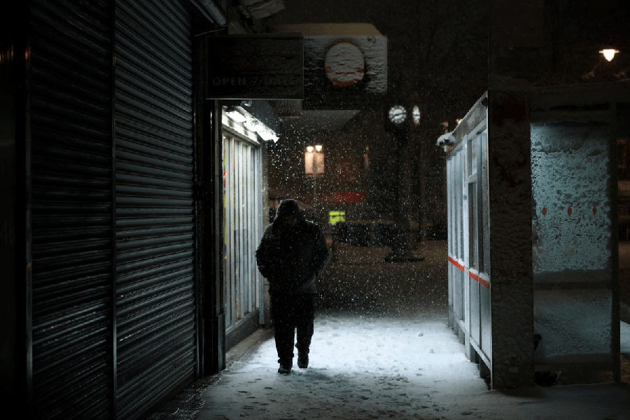 A person walks through the snow as Storm Goretti brings heavy snowfall and rain to Walsall, Britain, January 8, 2026.