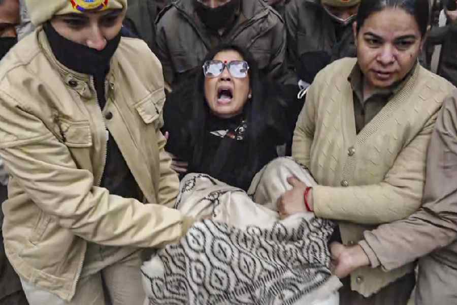 Trinamool MP Mahua Moitra being detained during the protest in front of the home ministry office in New Delhi on Friday against the ED raids on I-PAC.