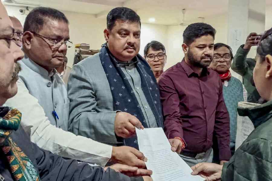 Members of the Opposition delegation at Dispur police station in Guwahati on Friday
