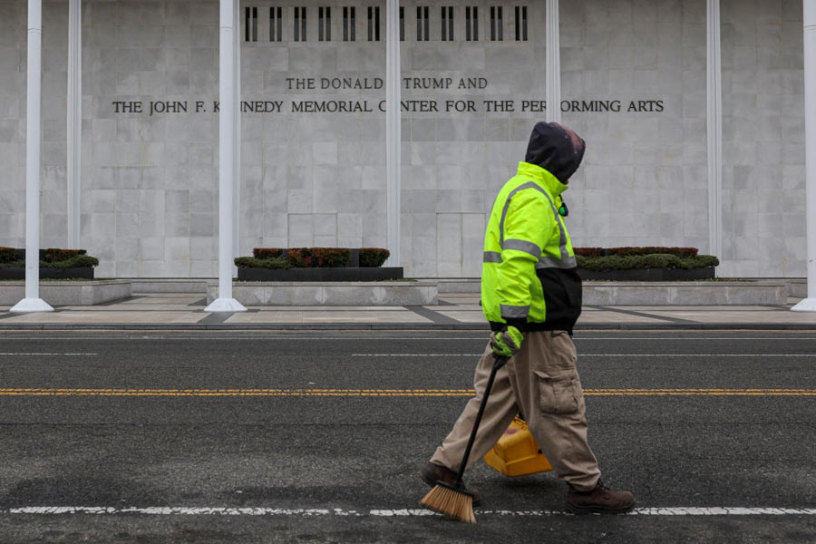 FILE PHOTO: A worker walks in front of the recently renamed Donald J. Trump and John F. Kennedy Memorial Center for the Performing Arts, in Washington, D.C.