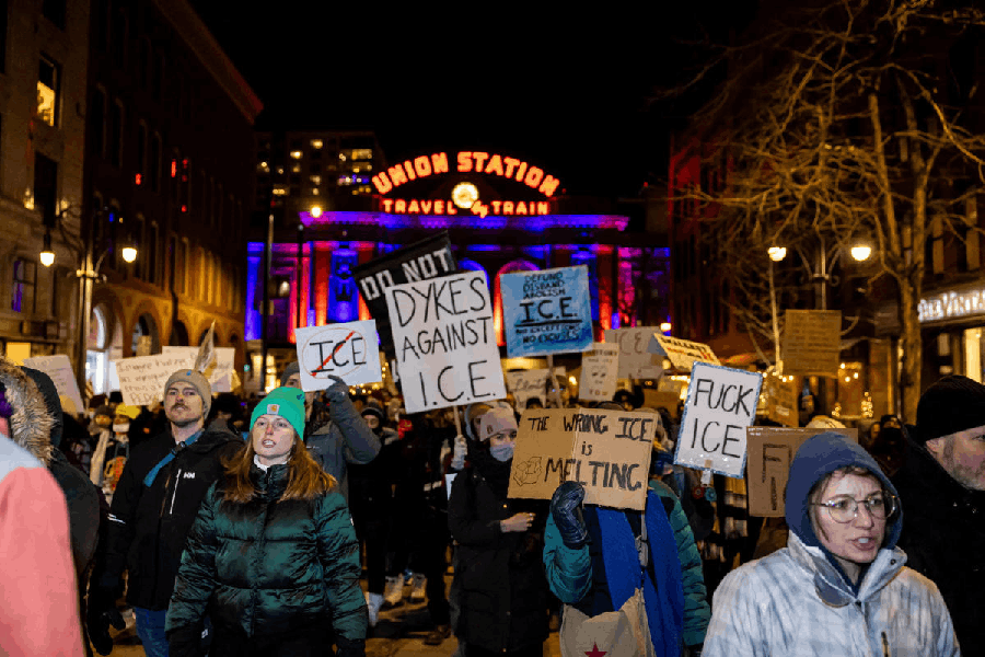 Protesters march and raise signs during a demonstration against increased immigration enforcement, days after the fatal shooting of Renee Nicole Good by a U.S. Immigration and Customs Enforcement (ICE) agent, in Denver, Colorado, U.S., January 9, 2026.